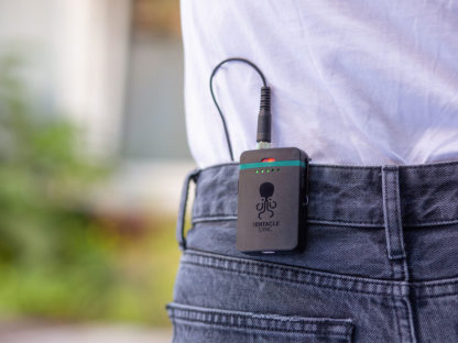 Portable TRACK E Audio Recorder fixed with belt clip to pants